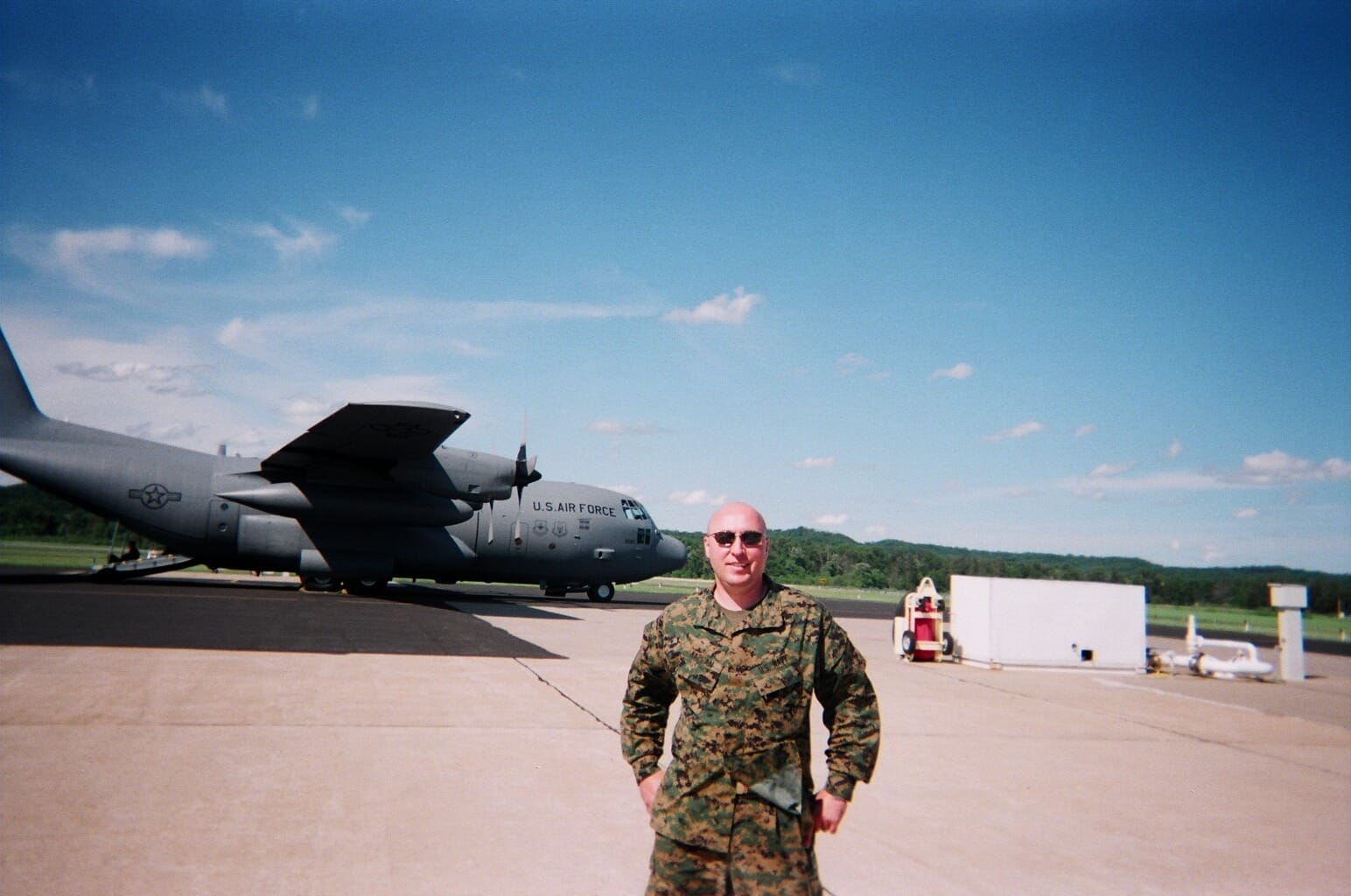 Michael Kaplan, owner of Garage Door Pro and U.S. Navy veteran, in uniform on an airfield