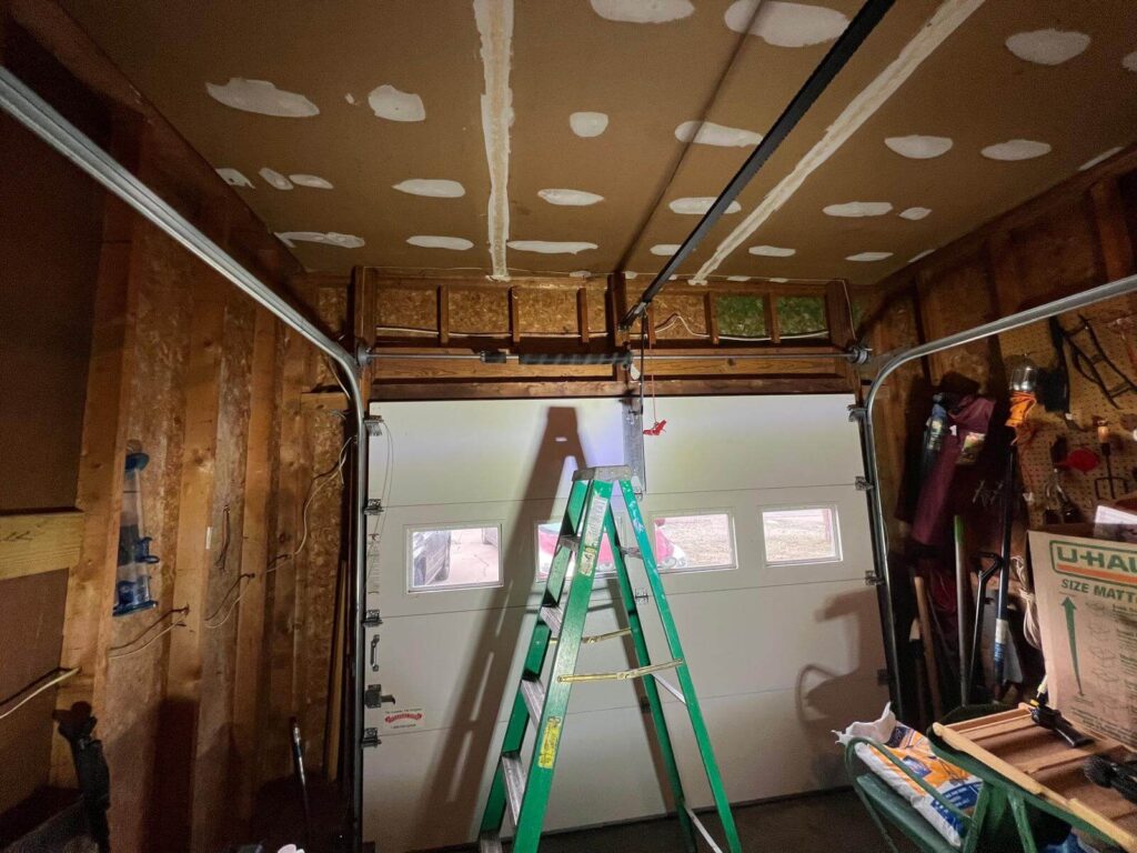 The garage door spring has broken on a single garage door.